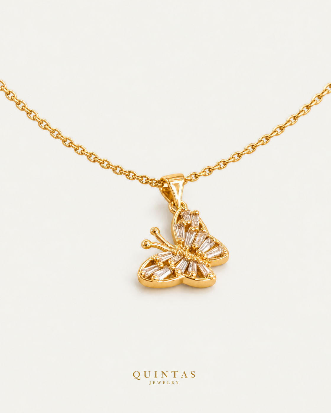 Glass Butterfly Necklace gold cable chain companion view, canonical Quintas logo