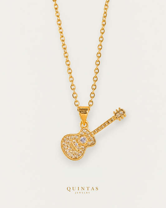 The Guitar Necklace gold cable chain, main view, canonical Quintas logo