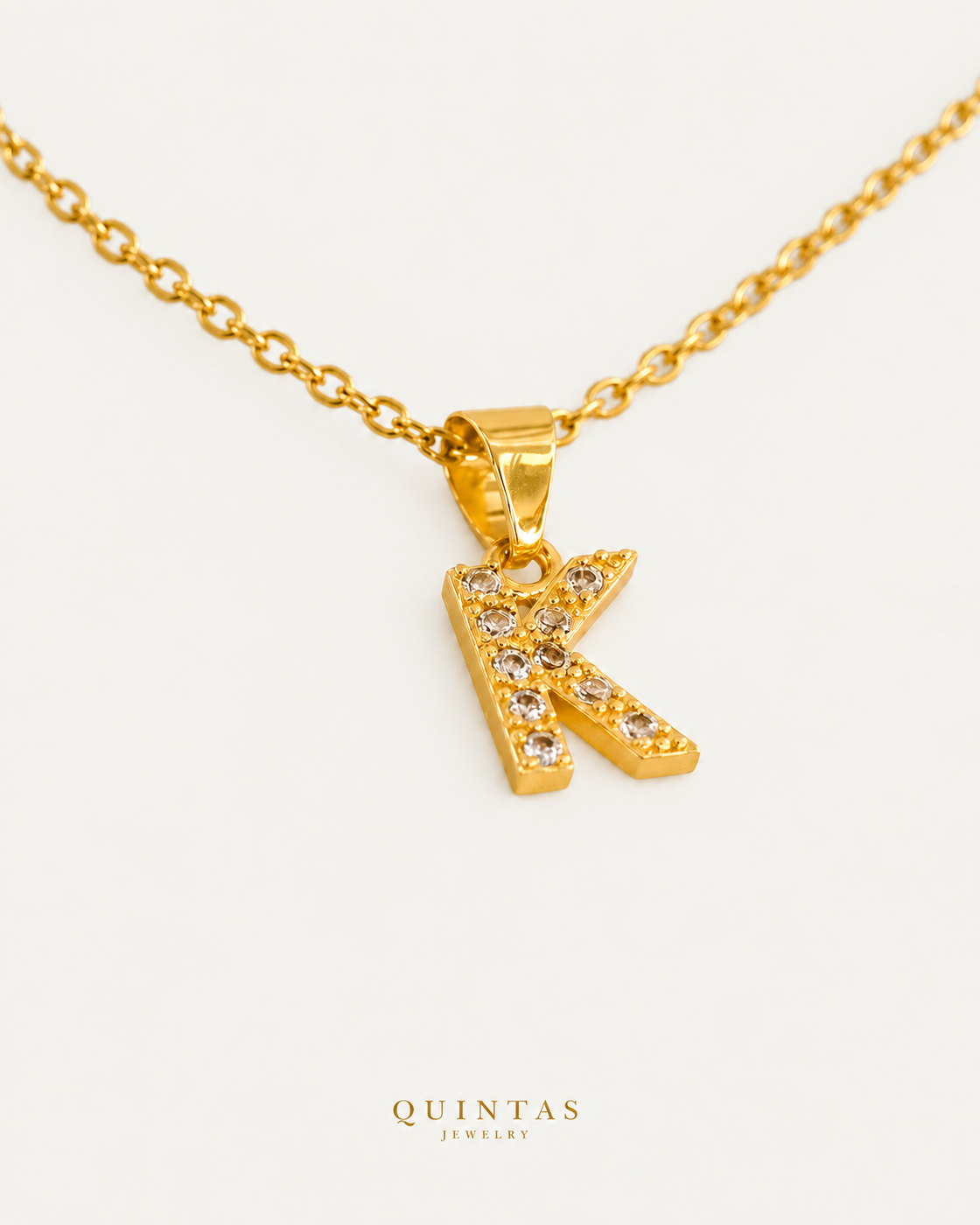 QUINTAS Zirconia Letter Initial Necklace K cable chain companion view, canonical Quintas logo