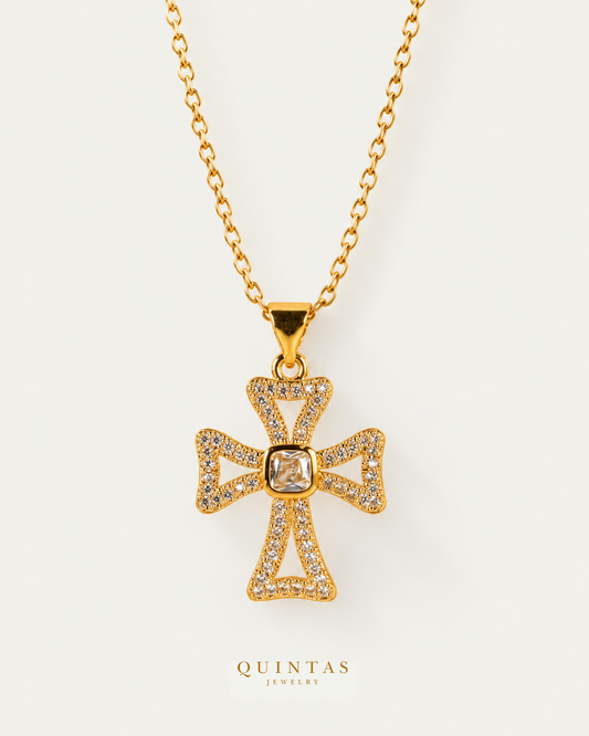 Harmony Diamond Cross Necklace — source-verified cable front view, off-white background, canonical gold logo