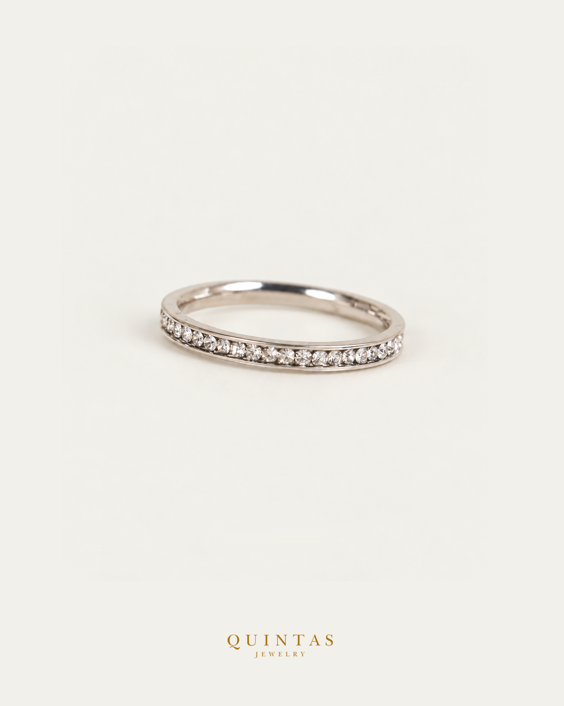 White Diamond Silver Ring standalone lying view with smaller framing on neutral greige