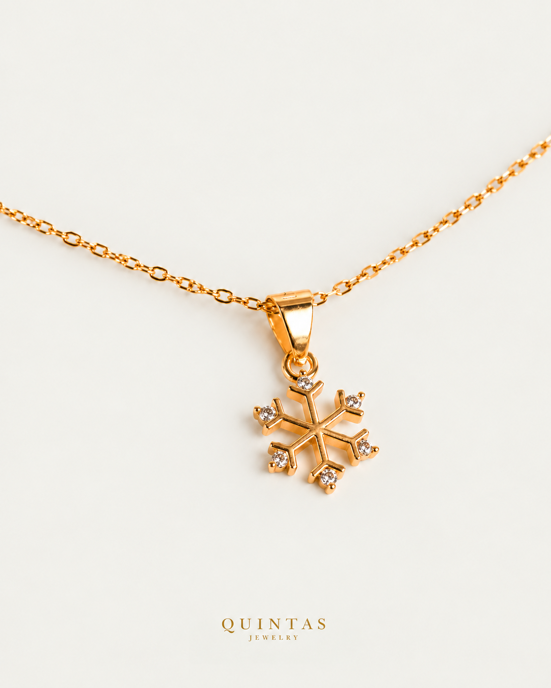 Princess Snowflake Necklace gold cable chain companion view, canonical Quintas logo