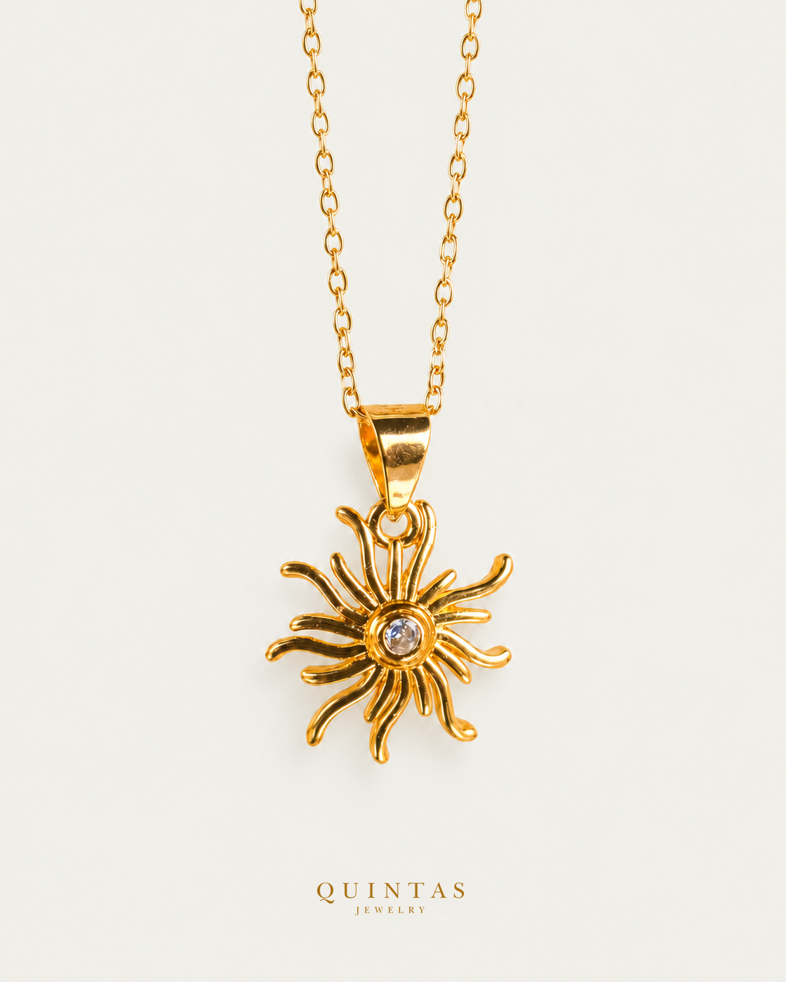 Tangled's Celestial Sun Necklace gold cable chain main view, canonical Quintas logo