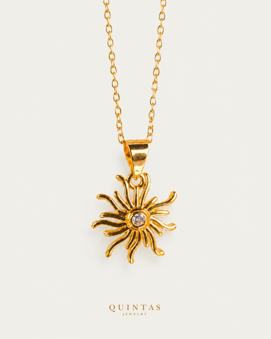 Tangled's Celestial Sun Necklace gold cable chain main view, canonical Quintas logo