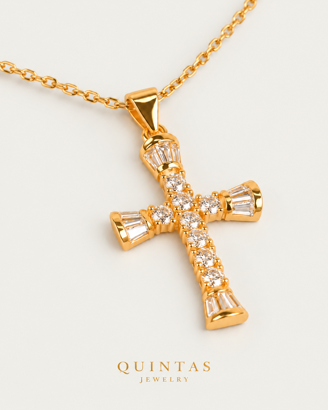 David Glass Cross Necklace, gold cable chain, oblique detail on neutral greige