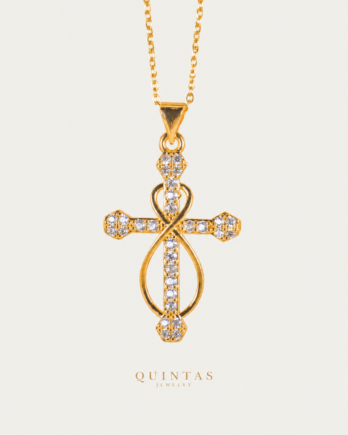 Infinity Faith Cross Necklace — gold cable chain, frontal hero, neutral greige