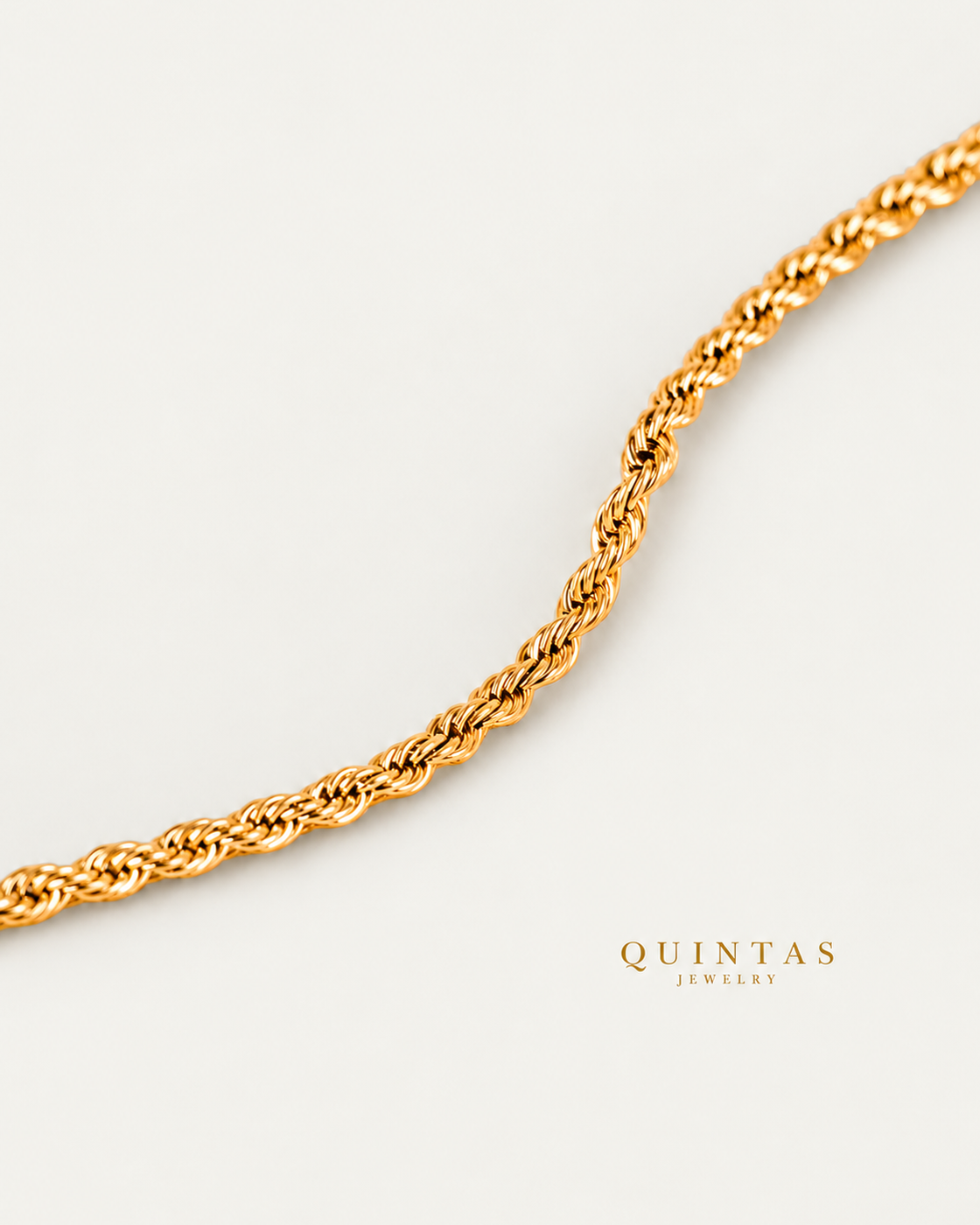 Matteo Rope Bracelet gold bracelet companion photographed angle on neutral greige