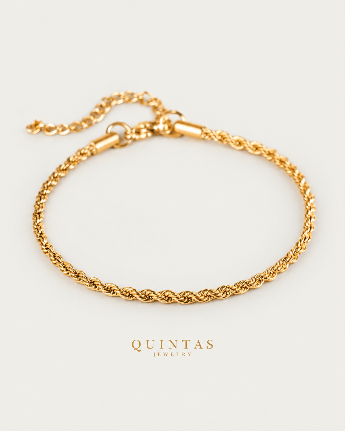 Matteo Rope Bracelet gold bracelet hero photographed angle on neutral greige