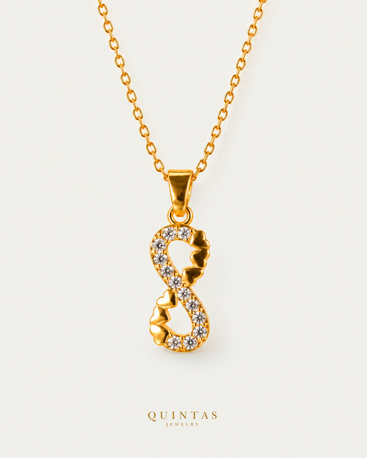 Infinite Hearts Necklace — gold cable chain, hero view, canonical Quintas logo