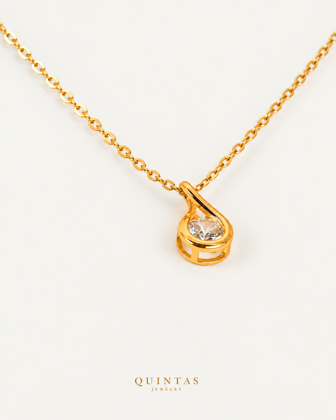 Solitaire Teardrop Necklace — gold cable chain, companion view, canonical Quintas logo