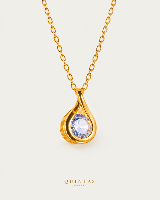 Solitaire Teardrop Necklace — gold cable chain, hero view, canonical Quintas logo
