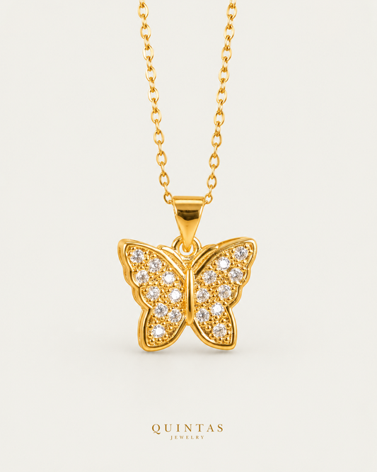 Emily Enchanted Butterfly Necklace — source-verified cable front view, off-white background, canonical gold logo