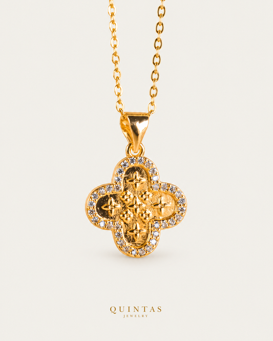 Clover Charm Necklace on gold cable chain, hero angle, neutral greige