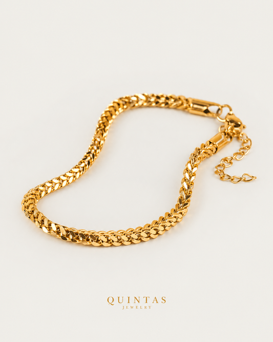 Square Cuban Link Bracelet gold bracelet hero photographed angle on neutral greige