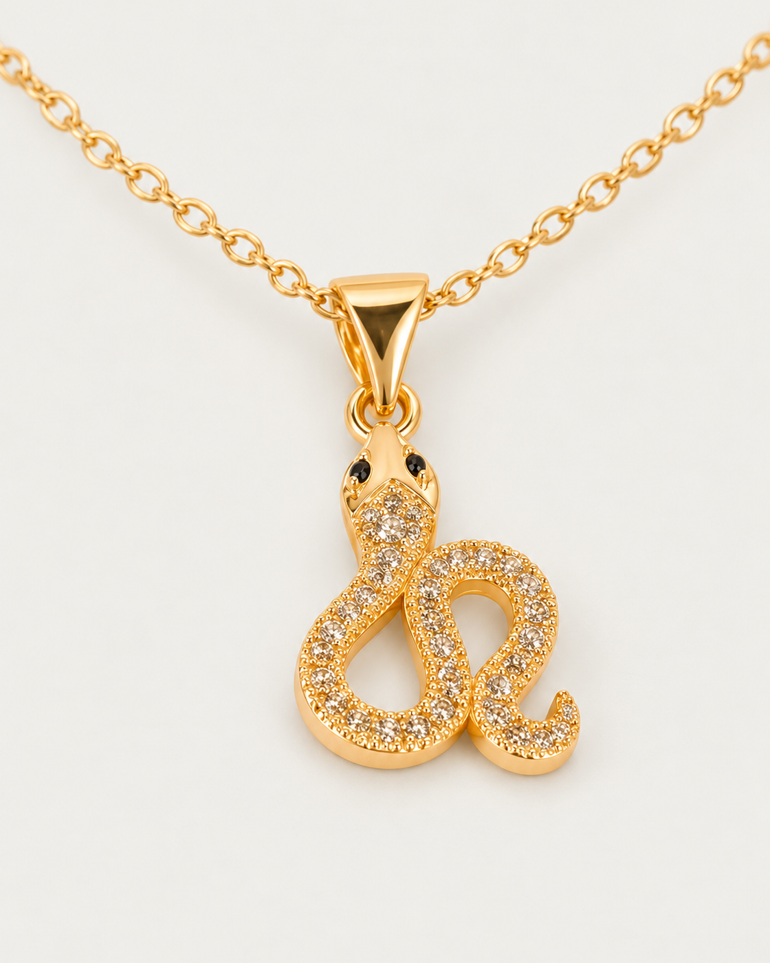 Athena Serpent cable chain companion photographed angle on neutral greige