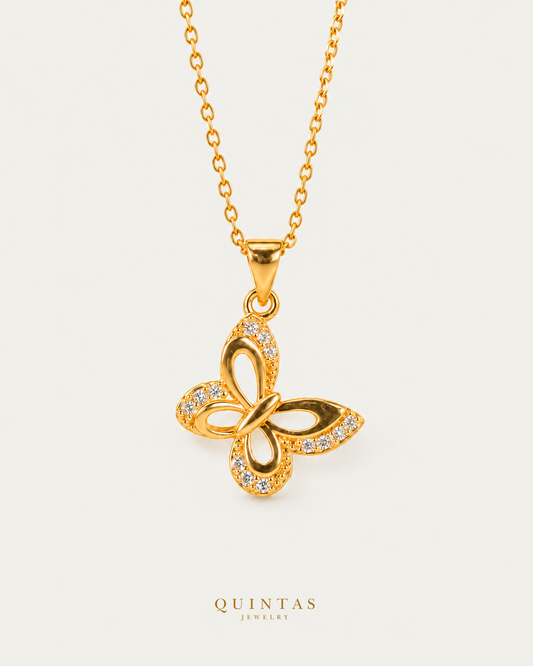 Marinella Butterfly Necklace — neutral greige; canonical Quintas Jewelry logo