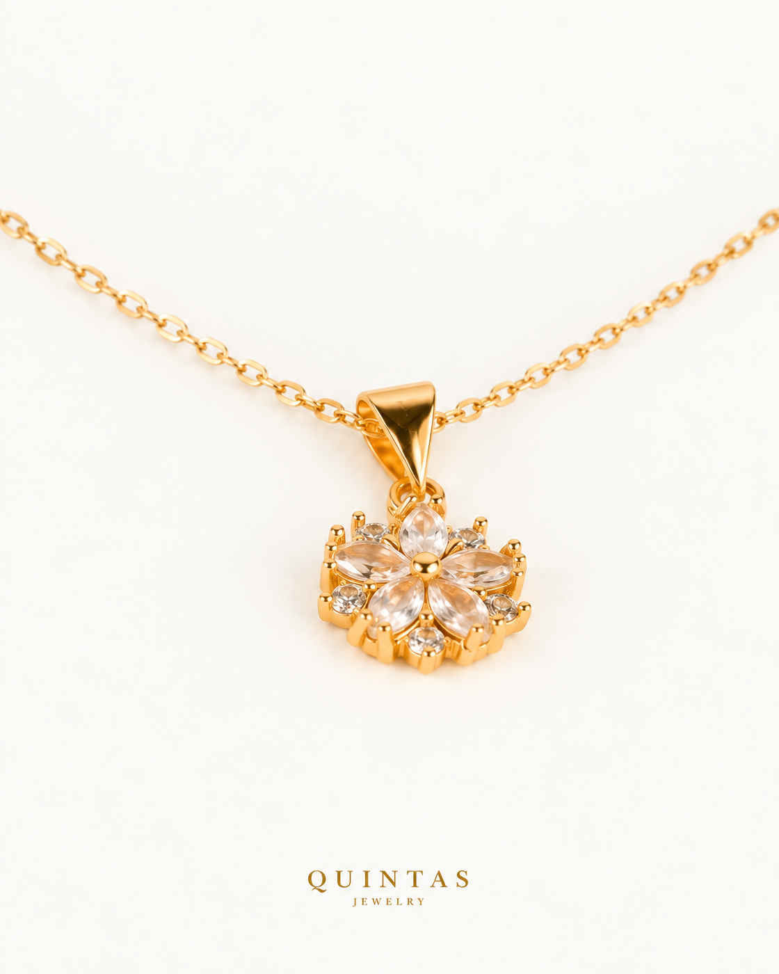 Arielle Flower Diamond Necklace — gold cable, genuine oblique angle, neutral greige; canonical Quintas Jewelry logo