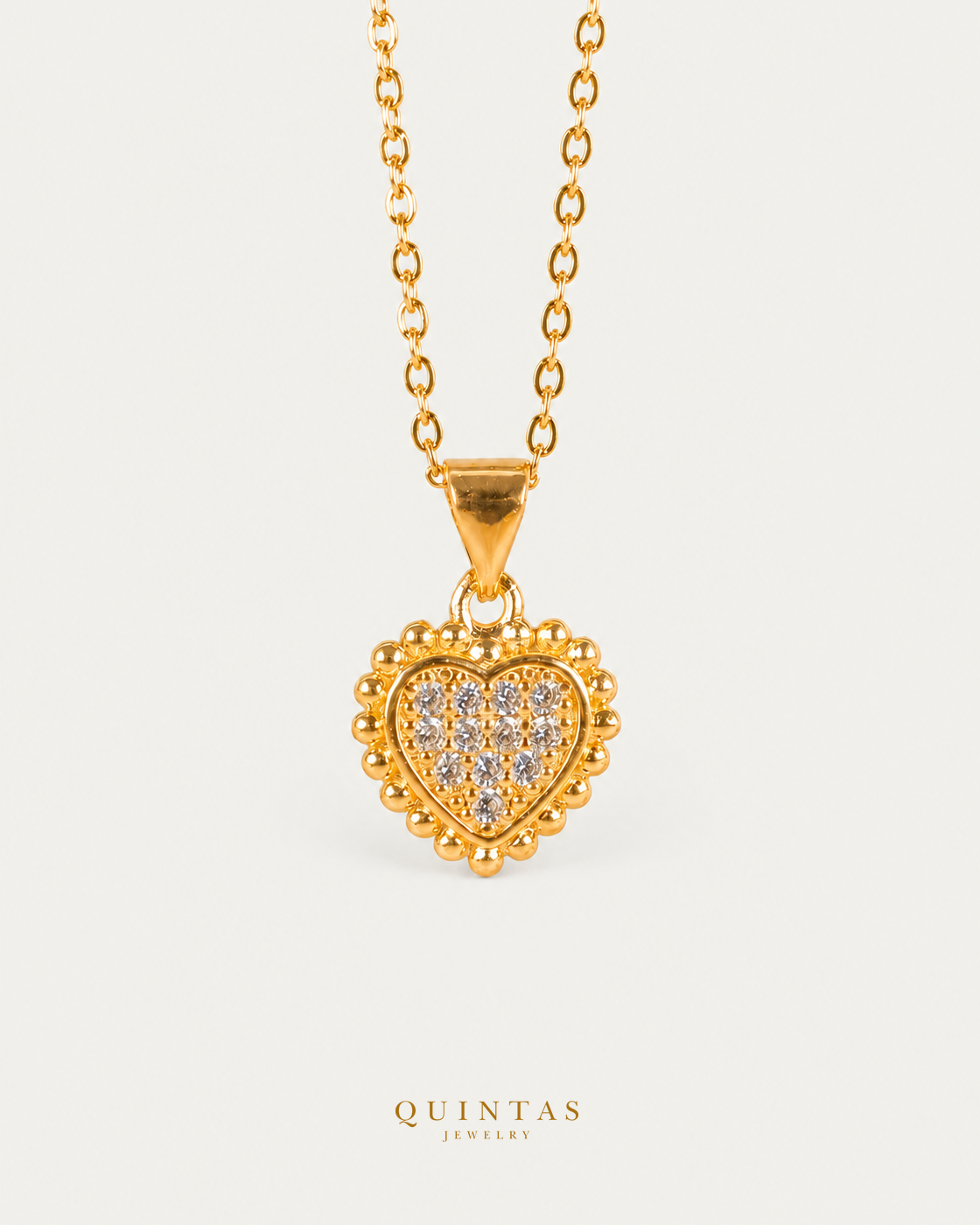 Carmela Heart Necklace hero with canonical Quintas Jewelry logo