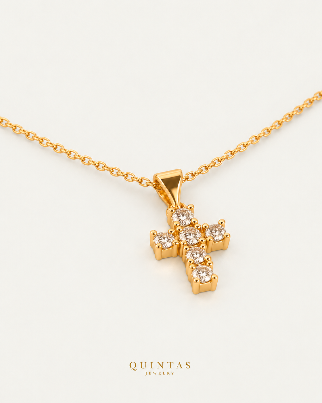 Sparkling Iced Cross Necklace on gold cable chain, companion angle, neutral greige