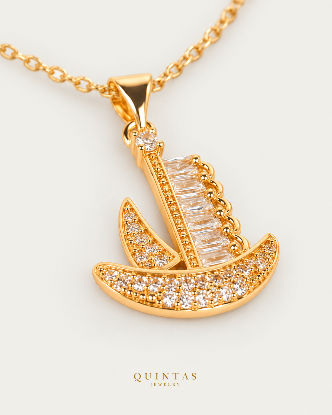 Voyager Ship Charm Necklace companion with canonical Quintas Jewelry logo
