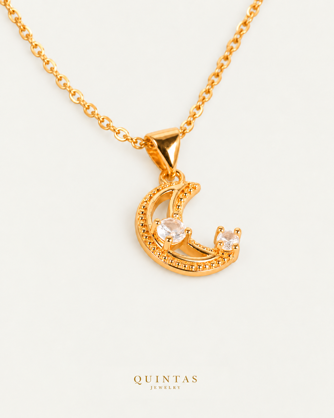 Celestine Moon Diamond Necklace — source-verified cable oblique view, off-white background, canonical gold logo