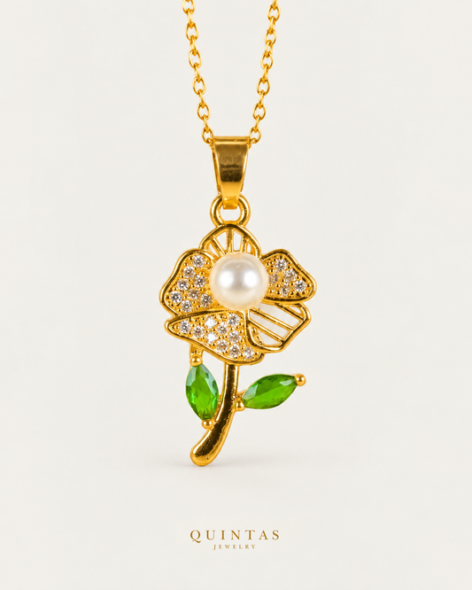 Pearl Flower Bloom Necklace — source-verified cable front view, off-white background, canonical gold logo