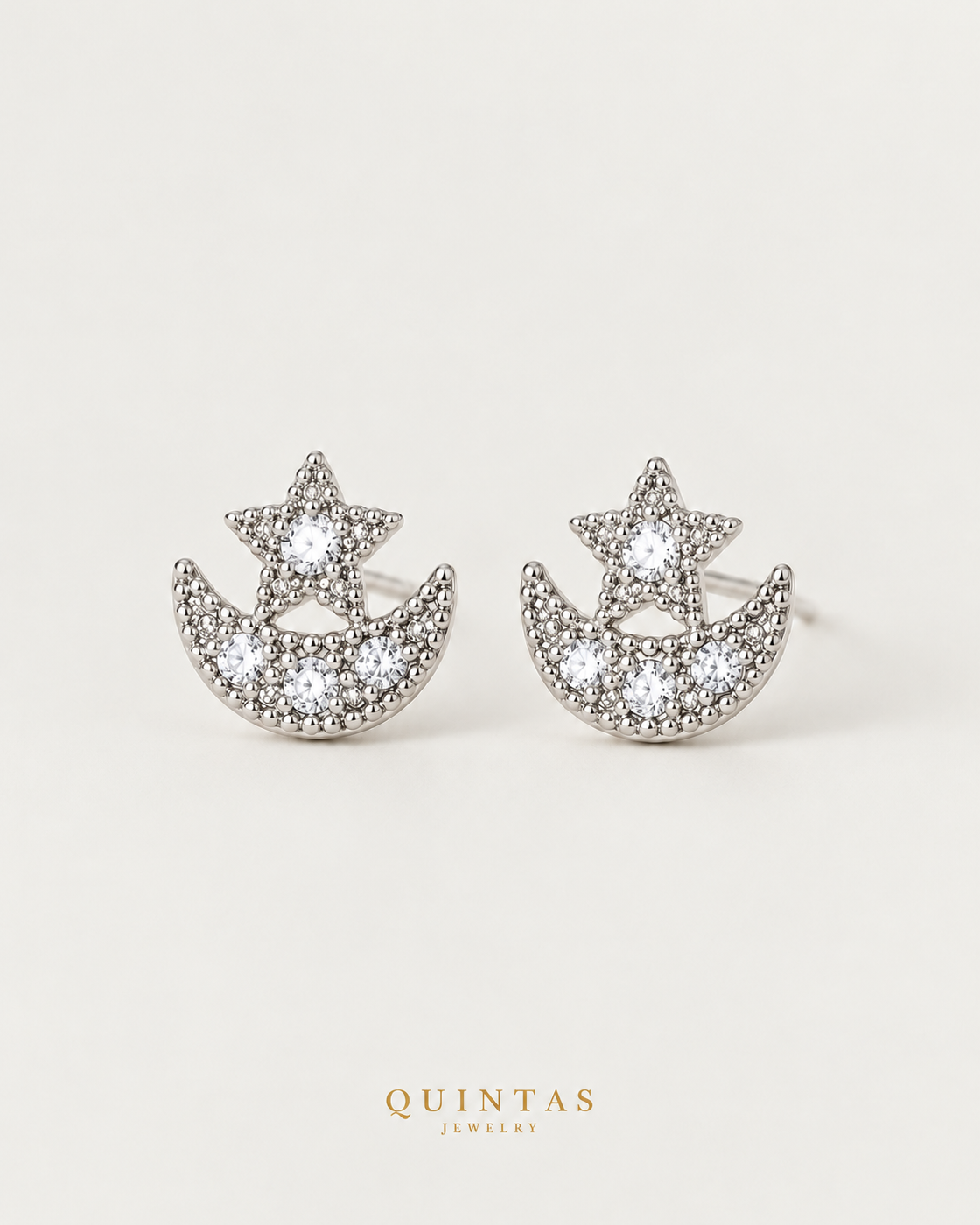 Astrid Moon and Star Silver Stud Earrings, silver stud earrings, neutral greige background