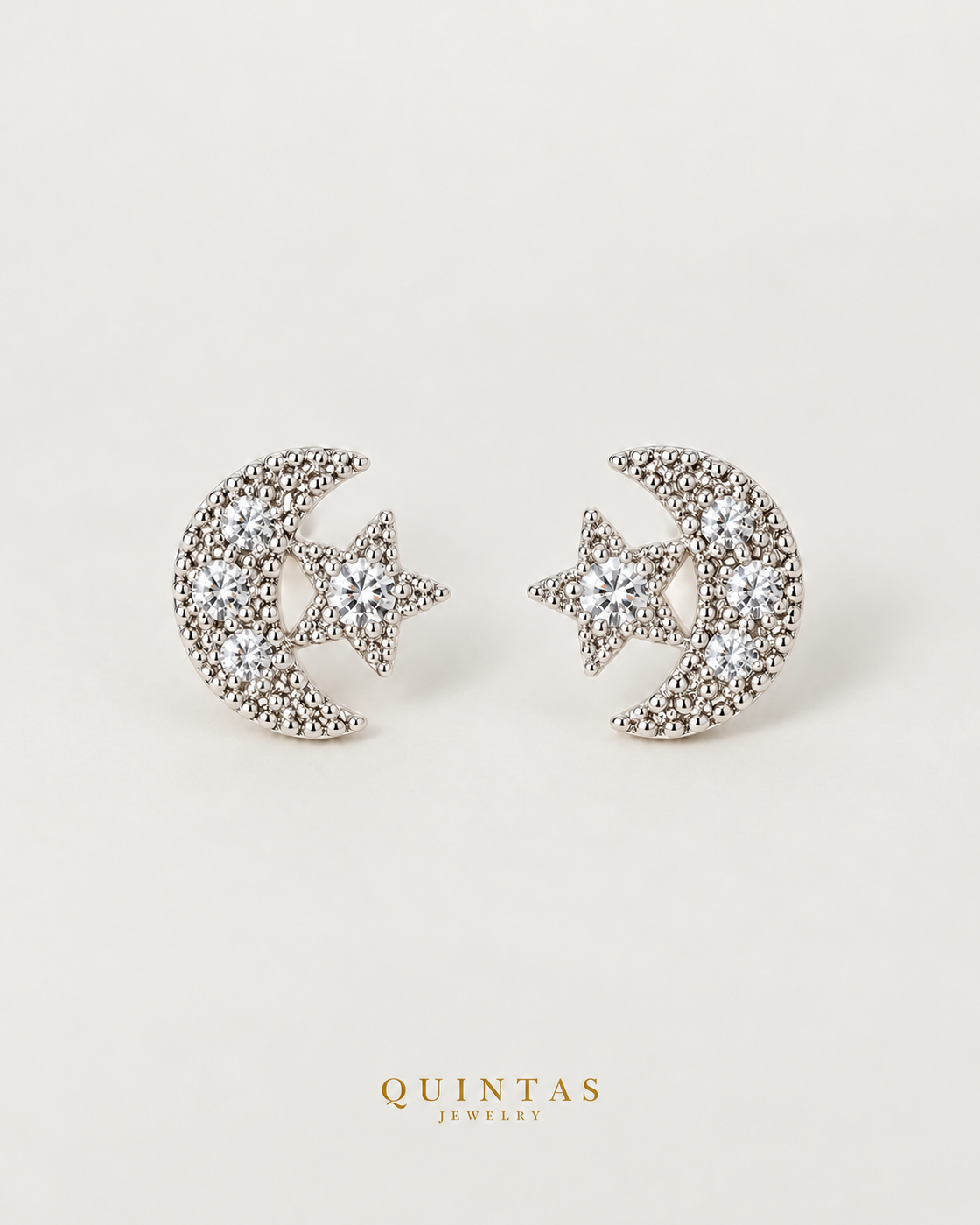 Astrid Moon and Star Silver Stud Earrings, silver stud earrings, neutral greige background