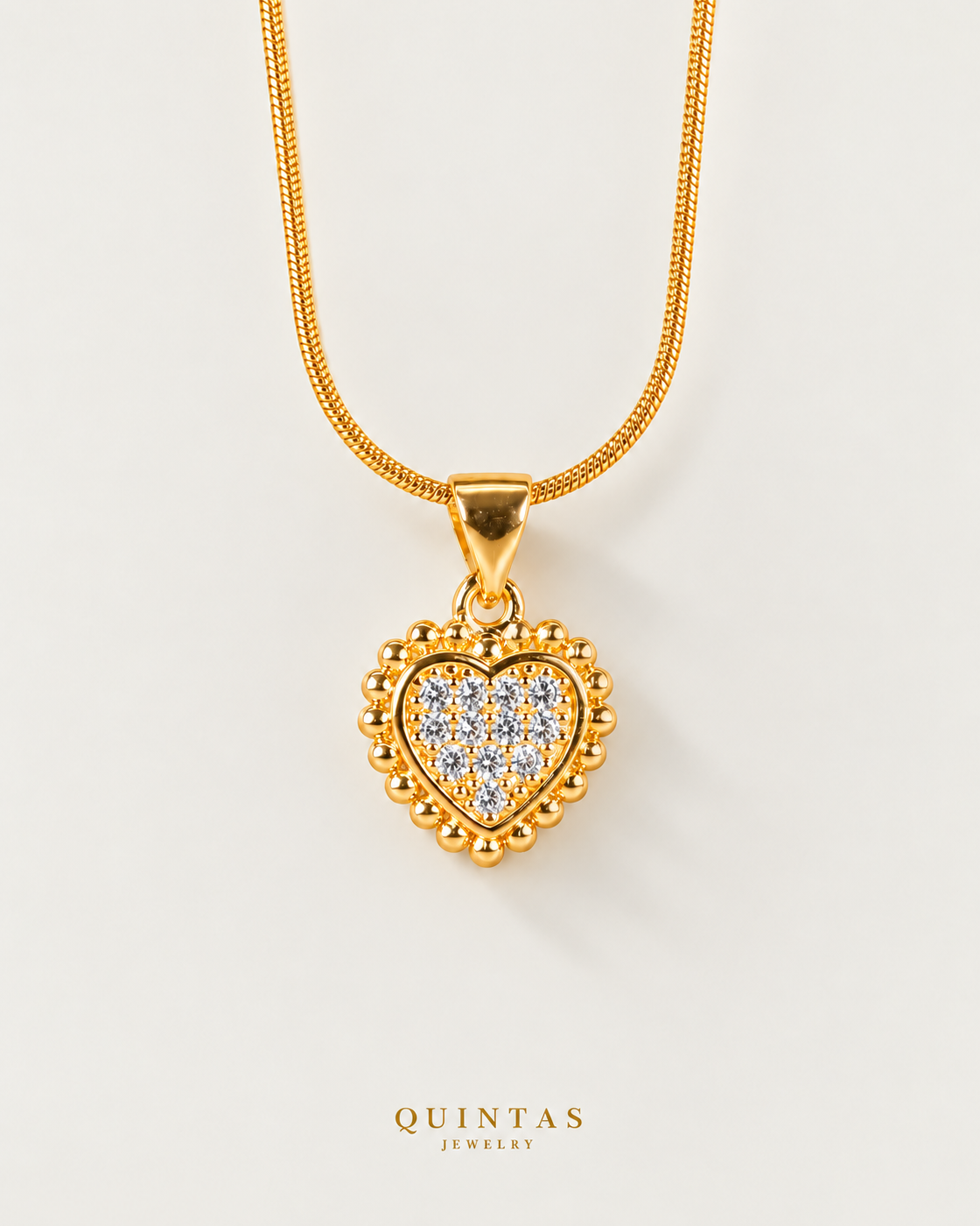 Carmela Heart Necklace, snake, neutral greige background