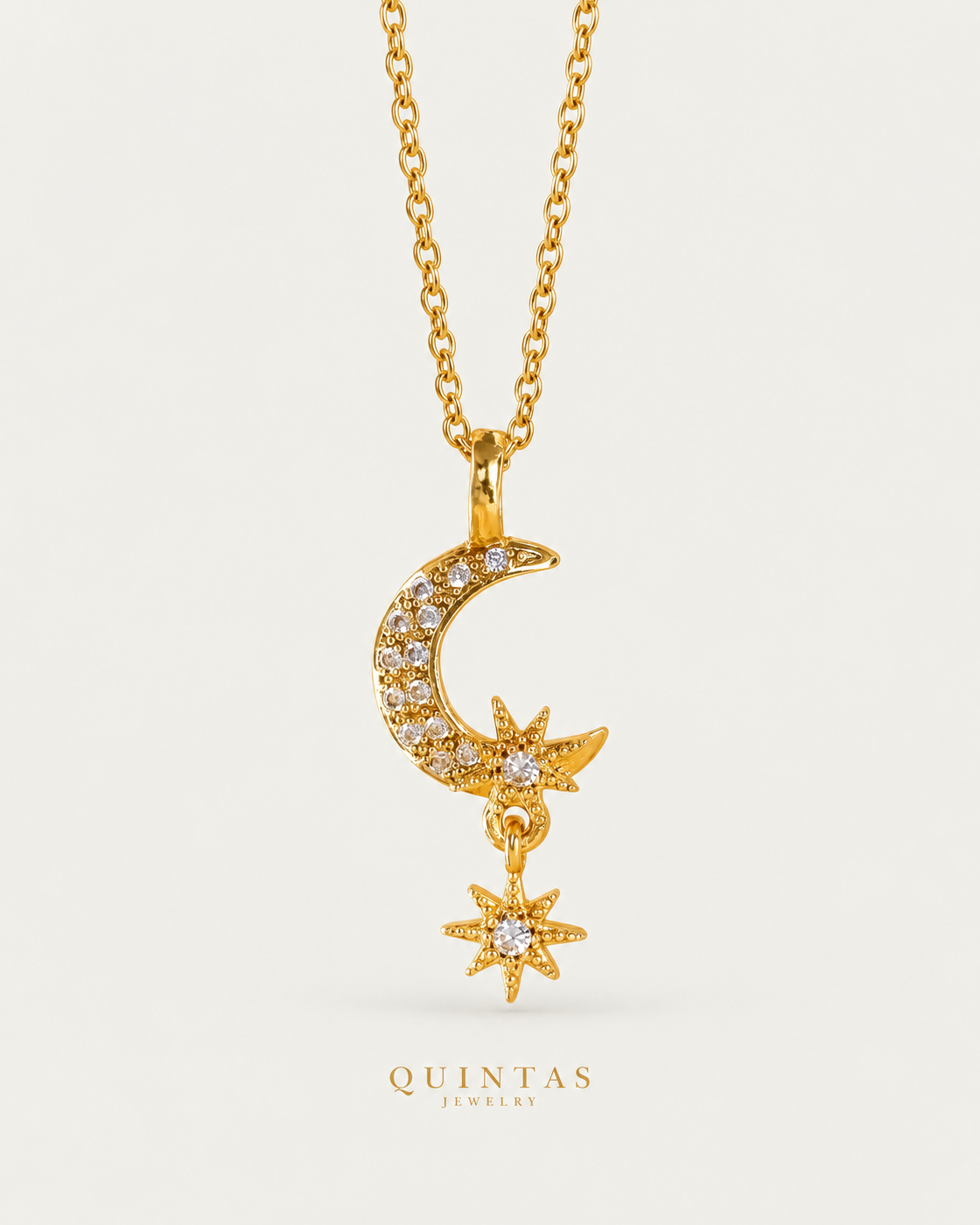 Gaia Moon and Star Necklace gold cable chain hero on neutral greige