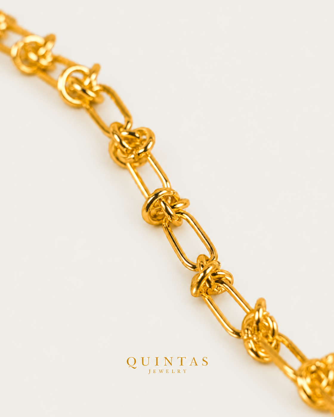 Golden Knot Link Bracelet, alternate physical-source detail angle, neutral greige