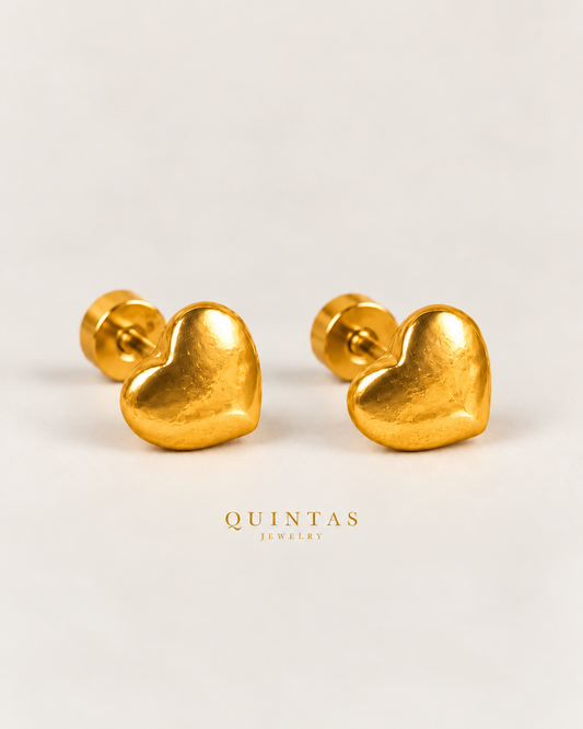 Golden Love gold heart flatback stud earrings — neutral greige main with softened reflections