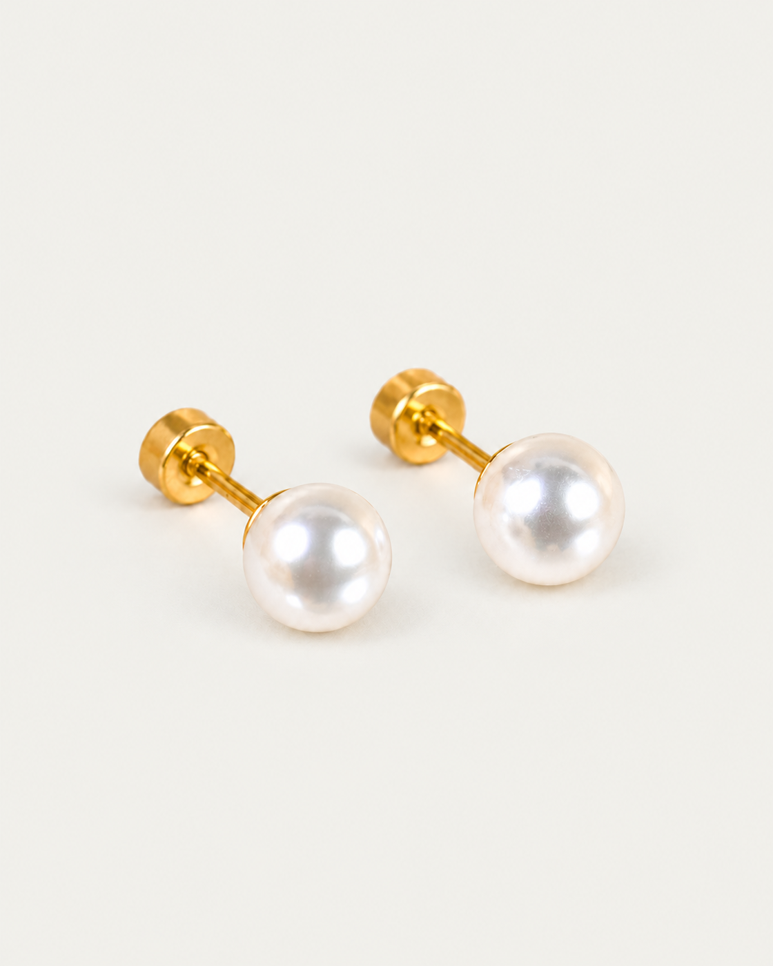 Grace Pearl stud earrings, oblique view with attached flat-disc backs