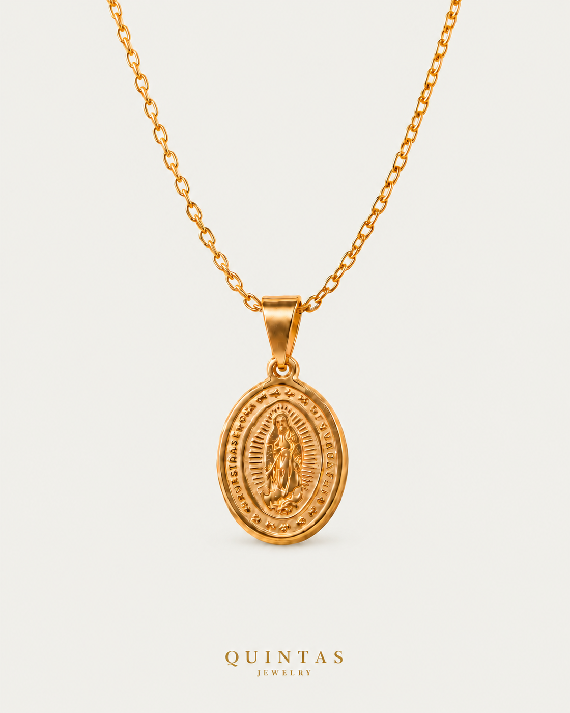 Guadalupe Medallion Necklace on gold cable chain on a neutral greige background with a faint soft shadow