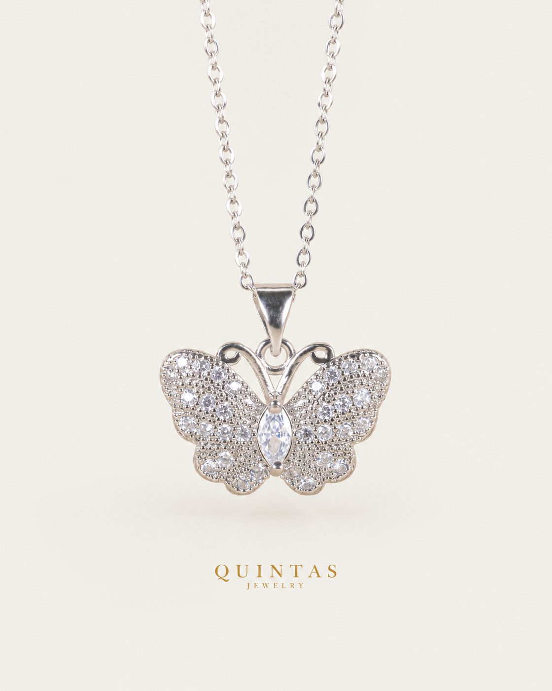 Jane Butterfly Silver Necklace, full physical-source view, neutral greige