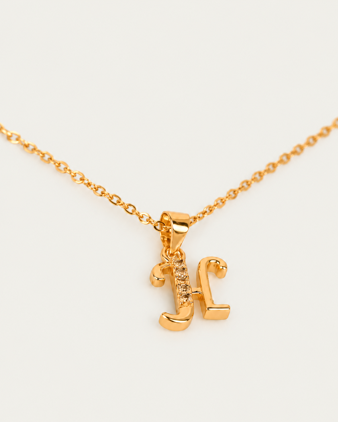 QUINTAS Letter Initial Necklace — H / actual cable-chain oblique view, neutral greige