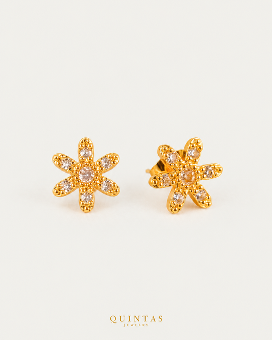 Maris Flower Charm Stud Earrings, full physical-source view, neutral greige