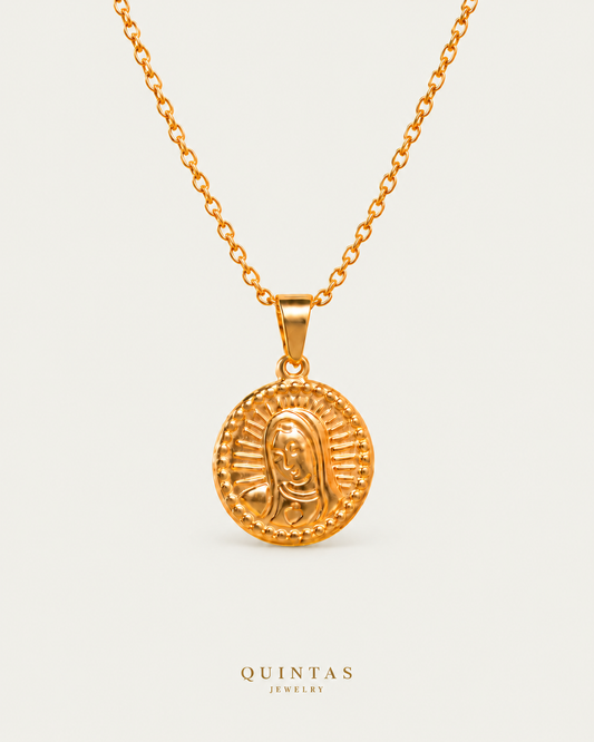 Mary Medallion Necklace on gold cable chain on a neutral greige background with a faint soft shadow