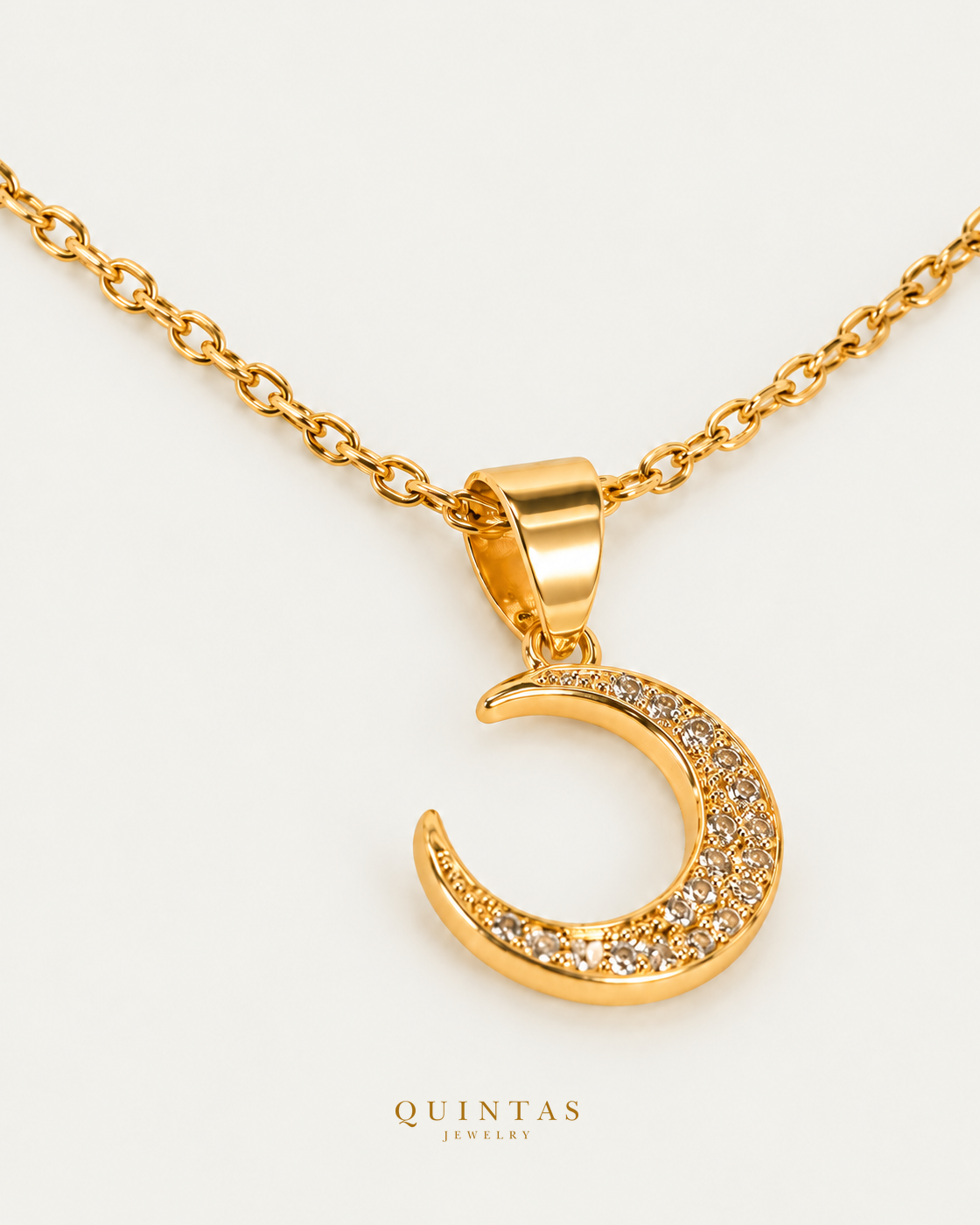 Moondust necklace on gold cable chain, oblique view with polished gold reflections