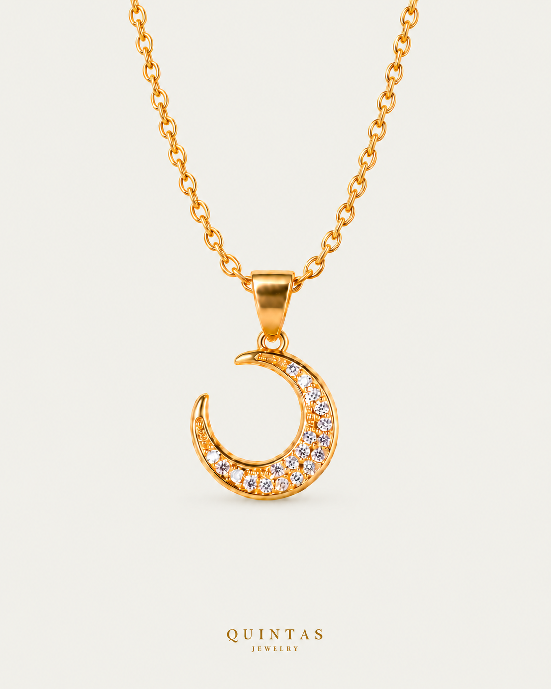 Moondust Necklace on gold cable chain on a neutral greige background with a faint soft shadow