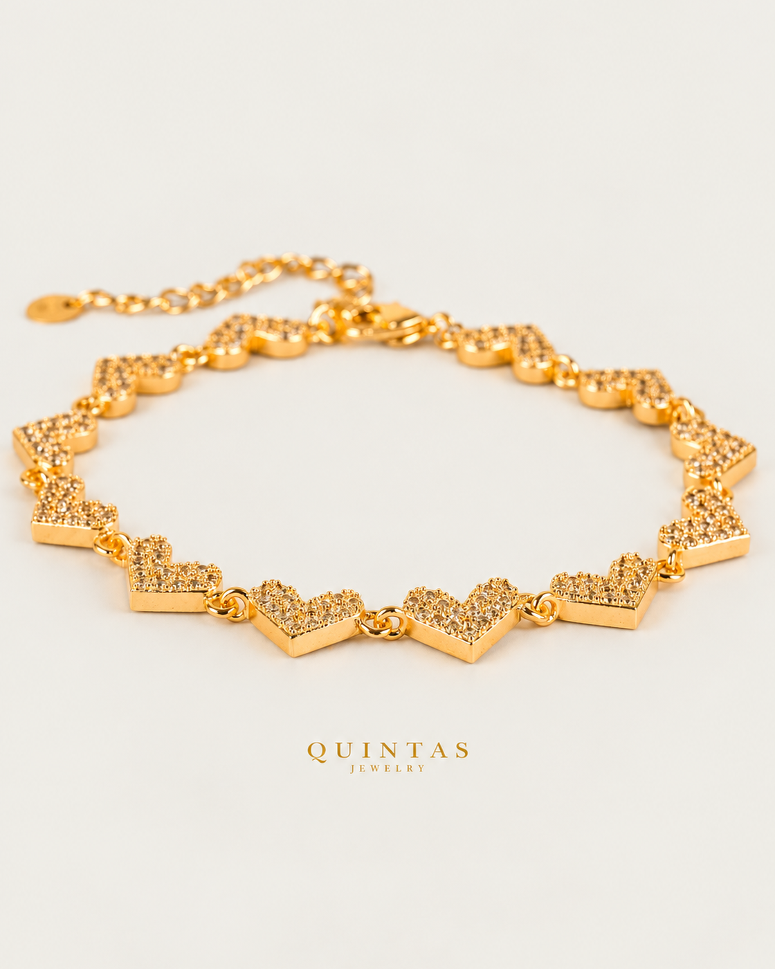 Novaria Hearts Charm Bracelet hero on neutral greige