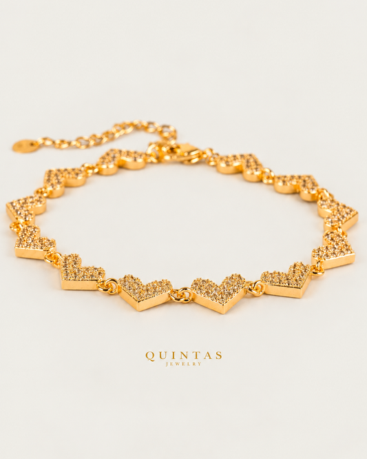 Novaria Hearts Charm Bracelet hero on neutral greige