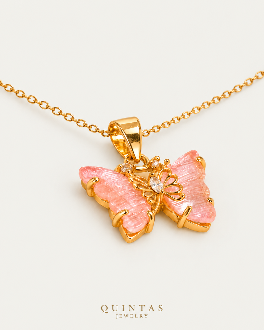 Pastel Butterfly Necklace pink pendant on gold cable chain, genuine oblique view