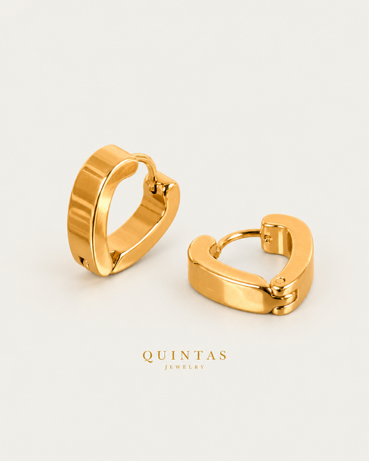 Portia Heart Hoop Earrings in gold, standing principal hoop and lying partner on neutral greige