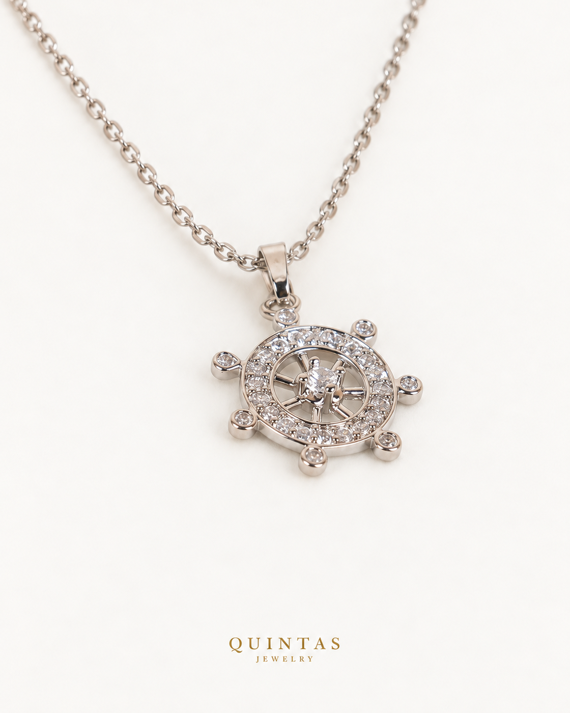 Ship Wheel Silver Necklace — source-verified wider silver cable oblique view