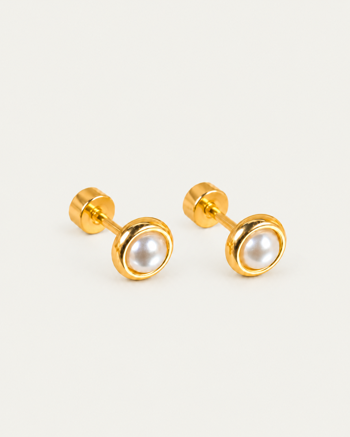Solenne Halo Pearl stud earrings, oblique view with attached flat-disc backs