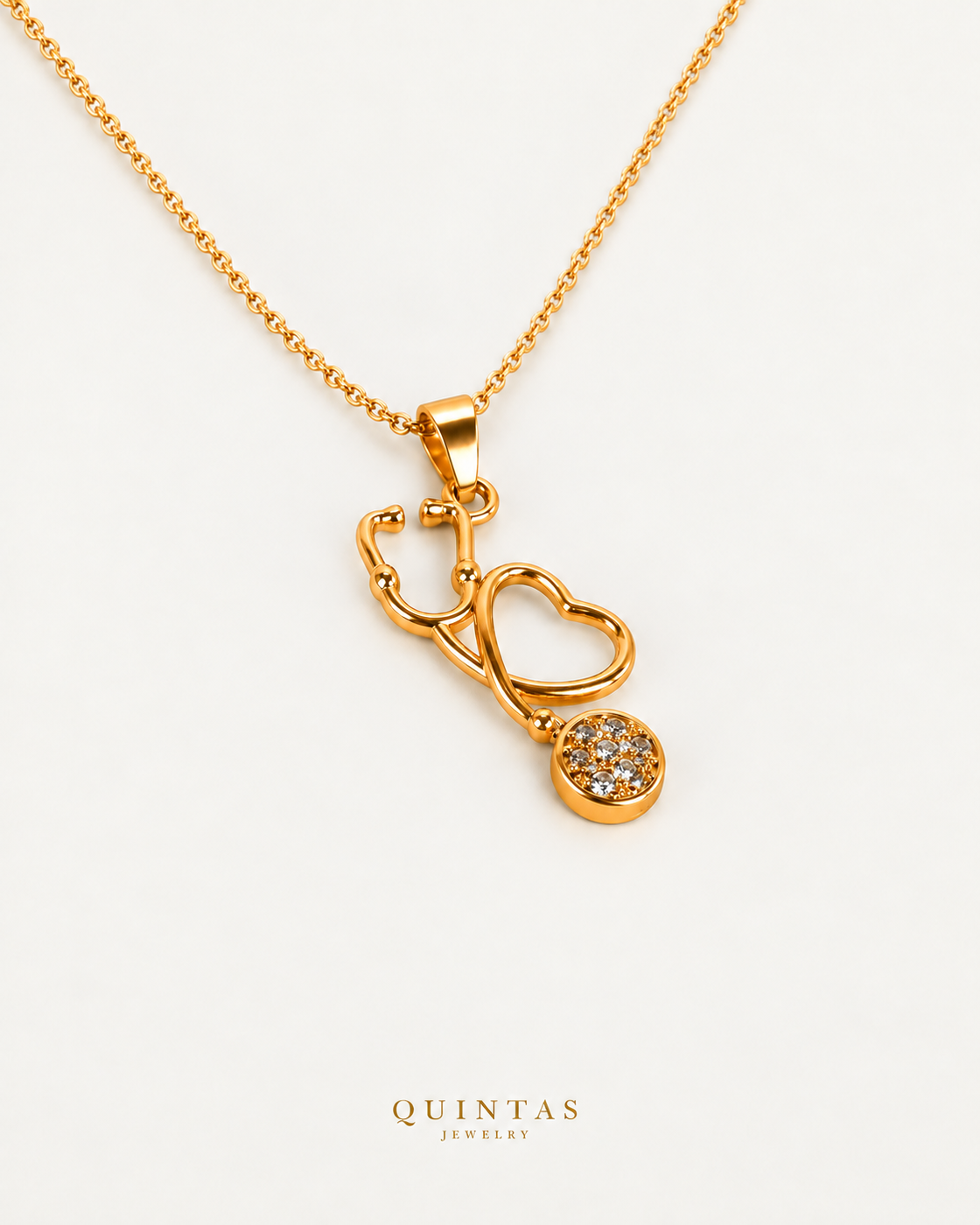 Stethoscope Charm Necklace, cable chain, oblique view with canonical Quintas Jewelry logo