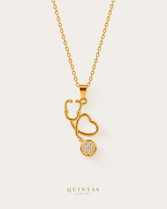 Stethoscope Charm Necklace, cable chain, canonical Quintas Jewelry logo, neutral greige hero