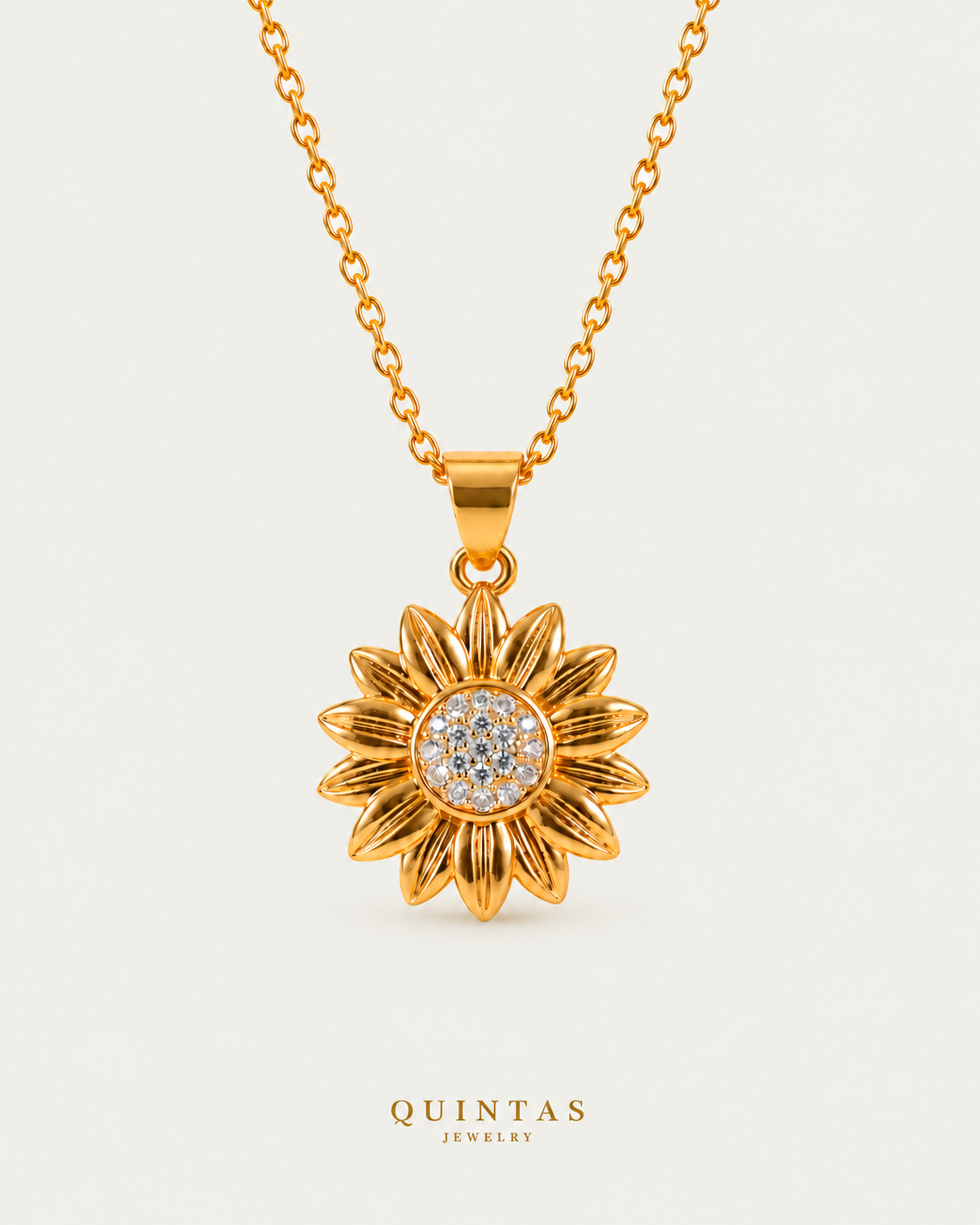 Sunflower Sunshine Necklace on gold cable chain on a neutral greige background with a faint soft shadow