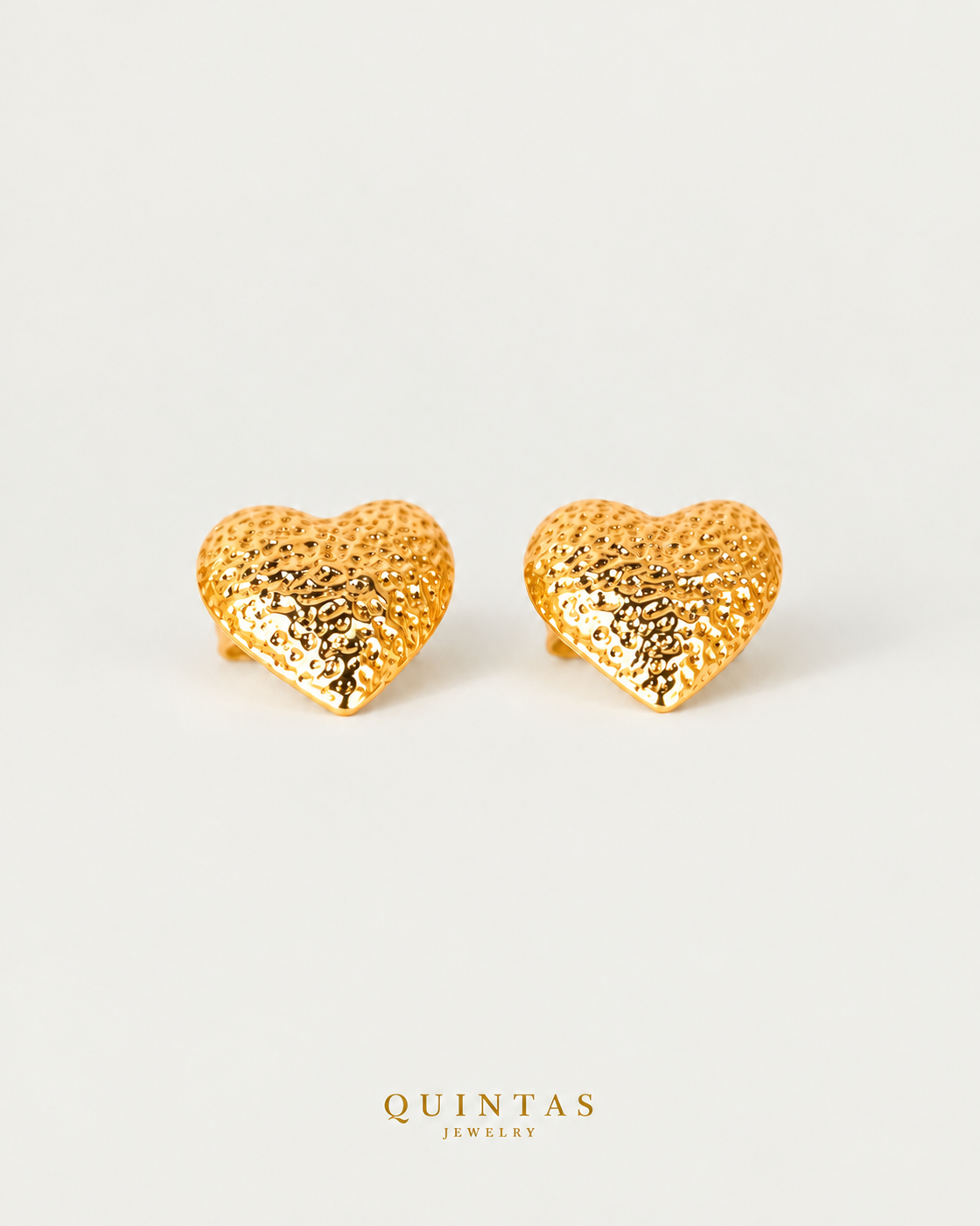 Vivere Heart Stud Earrings, yellow gold stud earrings, neutral greige background